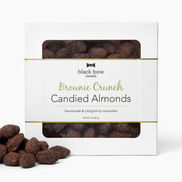 Square box of Black Bow Sweets brownie crunch candied almonds with gold foil border label.